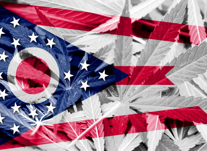 Ohio State Flag on cannabis background. Drug policy.